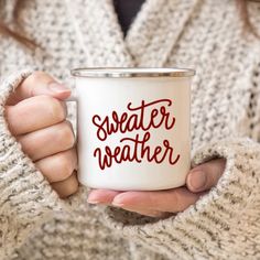 a woman holding a white coffee mug with the words morning pumpkin printed on it in orange