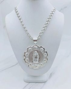 ✨ 925 Sterling Silver Sacred Jesus Pendant / Virgin Mary and necklace ✨ Double sided pendant Virgin Mary and Jesus  ✨ This medallion is approx 47mm or 1.85" ✨ Necklace chino link is 6.8mm and 26" long New jewelry Checkout my other items ✨ Dije de Plata 925 Medalla de Nuestra señora de Guadalupe y Sagrado Corazón  ✨ Doble cara ~ la Virgen María y Jesús  ✨ medalla mide 47 milímetros o 1.85 pulgadas ✨ Cadena mide 26 pulgadas y 6.8 milímetros Stock # 418695 P Stock #74064 Silver Our Lady Of Guadalupe Necklace, Silver Our Lady Of Guadalupe Pendant Jewelry, Spiritual Silver Necklace With Our Lady Of Guadalupe, Virgin Guadalupe, Mary And Jesus, Round Necklace, New Jewelry, Virgin Mary, Sterling Silver Pendant