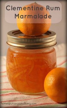 two oranges are sitting on top of a jar