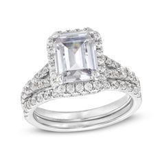 This emerald-cut lab-created diamond frame split-shank bridal set radiates with your love. Fashioned in 14K white gold. Showcases a 2 ct. emerald-cut certified lab-created diamond center stone. Round lab-created diamonds line the frame, split shank and contoured wedding band. I colour/SI2 clarity. Includes certification card. 3 cts. t.w. of lab-created diamonds. Emerald Cut Cubic Zirconia Wedding Ring With Halo Design, Emerald Cut Cubic Zirconia With Halo Design For Wedding, Dazzling Emerald Cut Wedding Ring With Halo Setting, Wedding Radiant Cut Lab Grown Diamond Jewelry, Dazzling Emerald Cut Ring With Halo Setting, Formal Moissanite Bridal Sets With Halo Setting, Emerald Cut Diamond White Wedding Ring With Halo Setting, Radiant Cut Wedding Ring With Diamond Accents, Radiant Cut Halo Setting Wedding Ring