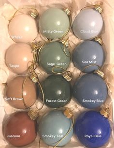 a box filled with lots of different colored christmas ornaments in it's packagings