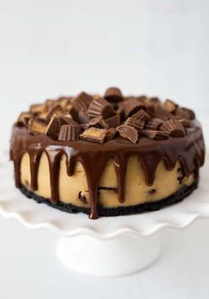 a cheesecake covered in chocolate and peanut butter