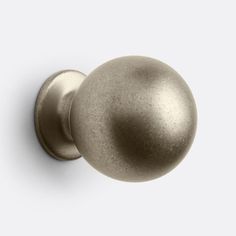 an antique brass door knob on a white background