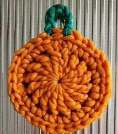 an orange object is hanging on a wall