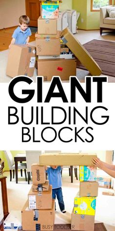 two boys are playing with giant boxes in the living room and one boy is standing on top of it