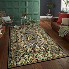 a living room filled with furniture and a large rug on top of a hard wood floor