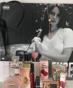 a table topped with lots of different types of cosmetics and personal care items on top of it