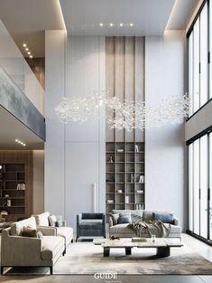 a living room with couches, chairs and a chandelier hanging from the ceiling