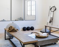 a living room filled with furniture and mirrors