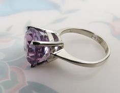 Elegant Lavender Jewelry With Center Stone, Classic Amethyst Jewelry With Prong Setting, Classic Jewelry With Prong Setting Amethyst, Elegant Lavender Solitaire Jewelry, Elegant Lavender Amethyst Ring, Elegant Amethyst Solitaire Ring With Round Stone, Elegant Amethyst Solitaire Ring With Round Band, Elegant Solitaire Amethyst Jewelry, Amethyst Ring With Brilliant Cut Cubic Zirconia