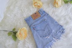 "Classic Blue Jean Baby, Highly coveted vintage 505 light to medium wash, cutoff & distressed Levi's jean shorts. These are a staple of every retro babe, who loves their levis! Mid rise, ultra short shorts and a booty hugging fit! The essence of vintage Levis is encapsulated in these perfect beauties. Literally can be styled so many ways and worn for years to come. Create new memories in these nostalgic loves of the past. Every fashionable babe needs a classic pair of Levi's jeans in their w Cheap High Rise 90s Jean Shorts, Cheap Retro Light Wash Jean Shorts, Cheap Retro Cutoff Jean Shorts, Affordable Light Wash Retro Jean Shorts, Affordable Levi's Light Wash Jean Shorts, Affordable Vintage Medium Wash Shorts, Affordable Light Wash Vintage Shorts, Cheap Vintage Cutoff Jean Shorts, Retro Light Wash Cutoff Shorts