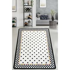 a black and white area rug with polka dots