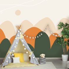 a child's bedroom with a teepee tent and trees in the background,