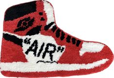 a pair of red and white sneakers with the word air on it