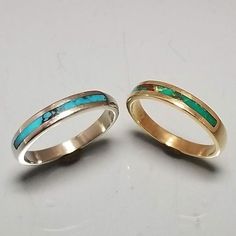 These are two 14k gold bands each inlaid with turquoise, The white gold band has blue turquoise size 6 1/2, the yellow gold band has green turquoise and is size 6. Either ring is $295. Turquoise Rings With Polished Finish For Anniversary, Gold Stackable Turquoise Ring For Anniversary, Gold Sterling Silver Turquoise Promise Ring, Gents Ring, Dinosaur Bones, Hand Ring, White Gold Band, Green Turquoise, Blue Turquoise