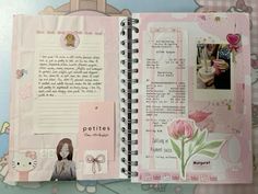 an open pink book with pictures and words on it's pages, including a cat