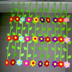 colorful paper flowers hanging from the ceiling