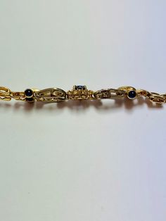 Stunning Vintage 14K White and Yellow Gold Diamond Sapphire Bracelet: Stunning Genuine Diamonds and Natural Sapphires Sapphire(s): 1.25CT Diamond(s): 0.80CT Color: F Clarity: SI1 Total Bracelet Weight: 17.5GR Bracelet Length: 7in Bracelet Width: 1cm 14K White and Yellow Gold For more information regarding this item feel free to reach me so I can accommodate your needs. Thank you Elegant Gold Bracelet With Polished Finish For Formal Occasions, Exquisite 14k Gold Bracelet, Formal Gold-plated Hallmarked Bracelets, Elegant 14k Gold Diamond Bracelet For Formal Occasions, Formal Hallmarked Gold-plated Bracelets, Classic Yellow Gold Bracelet For Evening, Formal Hallmarked Gold Plated Bracelets, Classic Yellow Gold Evening Bracelet, Elegant 14k Gold Bracelet For Formal Occasions