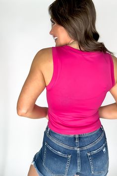 "Stay smooth and stretchy with the SR Basic Nina Fuchsia Flat Seamless Top. Perfect for any occasion, experience ultimate comfort and effortless style. No bumps or ridges for a sleek silhouette. Bye, bye bra lines!" Fit: She is wearing her true size medium. Fits true to size. If in between sizes, size down. Trendy High Stretch Pink Tank Top, High Stretch Seamless Pink Tank Top, Pink High Stretch Elastane Tops, Pink High Stretch Seamless Top, Pink Elastane Top With Built-in Bra, Fitted Pink Tank Top With Seamless Construction, Pink Top With Built-in Bra, Pink Seamlessly Fitted Tank Top, Pink High Stretch Casual Tank Top