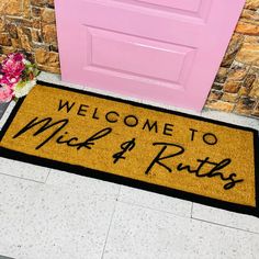 a welcome mat that says welcome to mr and mrs 4 ruths next to a pink door