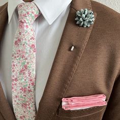 Handmade with 100% imported cotton fabric. Perfect for work, weddings or a night out on the town. This Floral Coral Pink Tie will make you feel like the gentleman you aspire to be or accentuate the gentleman you already are. You’ll look good, feel good and do good things in this tie. Makes the perfect gift for a fellow gentleman or for that man in your life by making them look good and feel good. We guarantee your satisfaction with our free refund policy.* Goes Good With: Beige, Tan, Navy, Grey, Earth Tone Wedding, Coral Tie, Flower Lapel Pin, The Gentleman, Bow Tie Set, Navy Grey, Look Good Feel Good, Pink Tie, Wedding Ties