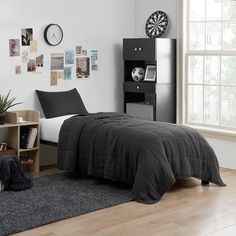 a bed room with a neatly made bed and a book shelf