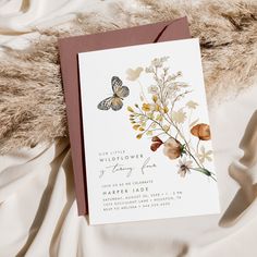 a wedding card with flowers and butterflies on it