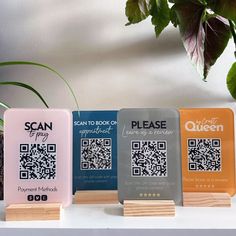 three different types of qr - code cards sitting next to each other