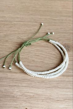 Waterproof and adjustable waxed cord bracelet with seed beads. Olive green and matte cream. Diy Cord Bracelets With Beads, Cheap White Braided Bracelet With Colorful Beads, Waxed Thread Bracelets, Wax Cord Bracelet Diy, Wax Thread Bracelets, Gelang Beads, Cord Bracelet Diy, Anklets Diy, Seed Beads Bracelet