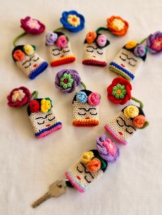 crocheted sugar skulls and flowers are arranged in the shape of a calzone