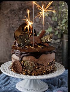 a chocolate cake with sparklers on top