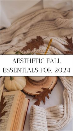 an open book and some autumn leaves on top of a white blanket with the title aesthetic fall essentials for 2014