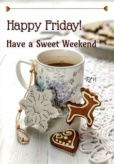 a cup of coffee and cookies on a table with the words happy friday have a sweet weekend