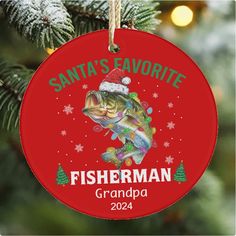 a christmas ornament with a fish on it and santa's favorite fisherman grandpa