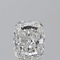 a cushion cut diamond on a white surface