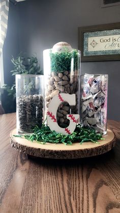 a baseball themed centerpiece is displayed on a table