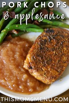 pork chops and applesauce on a plate with green beans