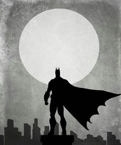 batman silhouetted against the full moon with cityscape in the background