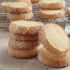 several sugar cookies stacked on top of each other