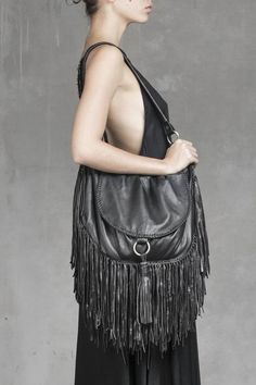 Fringe is in! This giant bag is perfect for storing your life inside! 100% super soft goat leather with brass detailing Adjustable strap Magnet clasp closure for main compartment Designed by Sparrow for Jan Hilmer Lioness Queen, Leather Fringe Bag, Black Leather Bag, Travel Bags For Women, Fringe Bags, Black Leather Bags, Goat Leather, Leather Fringe, Hand Cast