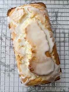 a close up of a doughnut on a cooling rack with frosting and icing