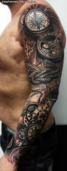 a man with a clock and compass tattoo on his arm is standing in front of a white wall