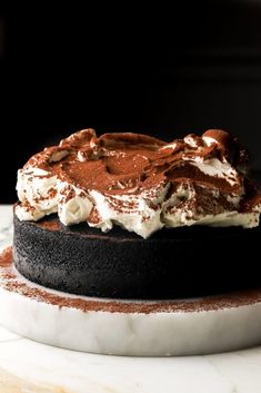 a chocolate cake with whipped cream on top