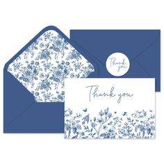 a blue and white floral thank card with the words thank you written on it's envelope