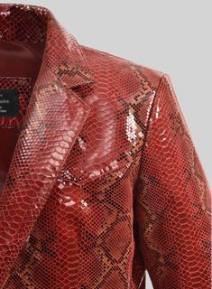 Be labeled as a trendsetter with our Bold Red Python Western Leather Blazer that has a touch of elegance and style, making you the most affable personality in the room. So create the most amazing attire with our leather blazer that will be strong couture in your closet.    Made Using Pure Napa Sheep Skin Leather.  Look Includes   Bold Red Python Leather Color  Two Button Jacket Style  Single Vent  Western Leather Blazer Style    Click 'Customize Now' to modify the look if needed.   Made as per Luxury Leather Jacket With Crocodile Pattern For Fall, Luxury Crocodile Pattern Leather Jacket, Luxury Red Evening Outerwear, Luxury Red Outerwear For Evening, Luxury Red Leather Jacket, Luxury Fitted Red Leather Jacket, Luxury Red Blazer For Parties, Luxury Red Blazer With Notch Lapel, Designer Red Blazer For Business