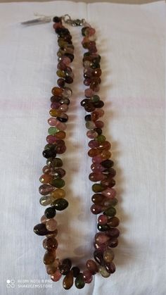 Awesome 373 Carat Fine Quality Natural Multi Tourmaline Plain 18 Inch Necklace Stone :Natural Multi Tourmaline Shape :- fancy Drop Necklace - 18 inch Size :- 5x8mm to 6x10mm Weight :-373 carat Polish :- Handmade Purity :- 100% Natural Gemstone color - multi makes a great gift for your loved ones. It is known as the 'love stone' as the message it emits is the strong vibration of unconditional love, joy, warmth and healing. As quartz crystals are profound amplifiers of energy, it may help to kindl Tourmaline Gemstone Beads Necklaces, Round Tourmaline Necklace With Natural Stones, Round Tourmaline Gemstone Necklaces, Oval Tourmaline Natural Gemstones, Oval Tourmaline Gemstones, Handmade Tourmaline Gemstones, Carnelian Bracelet, Necklace Stone, 108 Bead