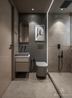 a bathroom with a toilet, sink and mirror