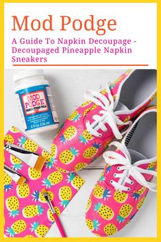 a pair of pink shoes with pineapples on them next to a jar of glue