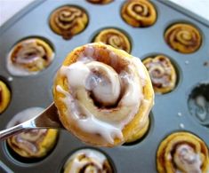 a close up of a pastry in a muffin pan