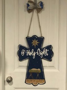 "Cross door hanger \"O' Holy Night\" perfect for displaying the real reason for the Christmas season. Item is 22x15 custom made out of 1/4 inch plywood and custom hand painted using acrylic paint. Wooden door hangers are spray sealed with a clear protective coating so they will hold up under outdoor use. Thanks for shopping Southern Style Today" Holy Night Christmas Decor, Sunflower Door Hanger, Cross Door Hangers, Silent Night Holy Night, Night Christmas, Oh Holy Night, Wooden Door Hangers, O Holy Night, Wood Crosses